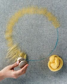 someone is using a brush to paint the carpet