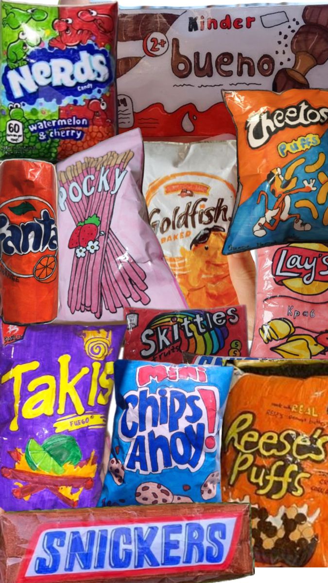 many different types of snacks are stacked on top of each other, including chips and candy