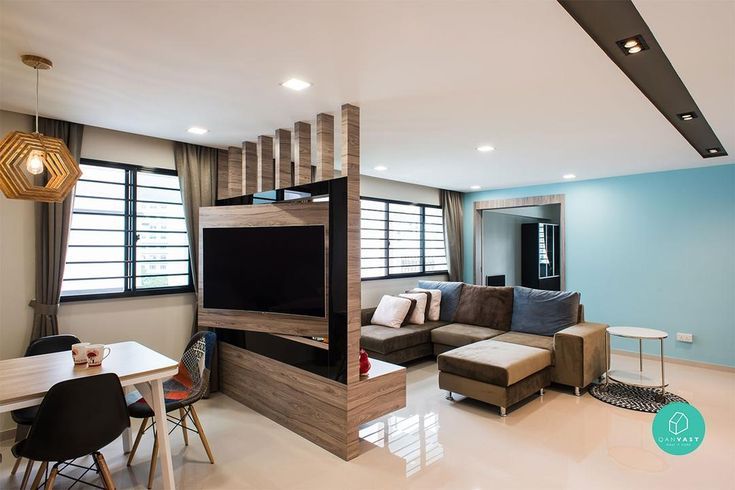 a living room filled with furniture and a flat screen tv