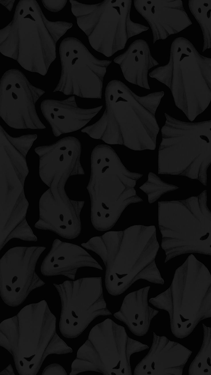 black and white image of many ghost heads in the dark, with one face partially hidden