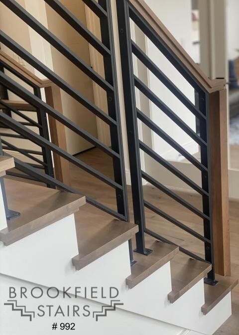 the stairs are made of metal and wood