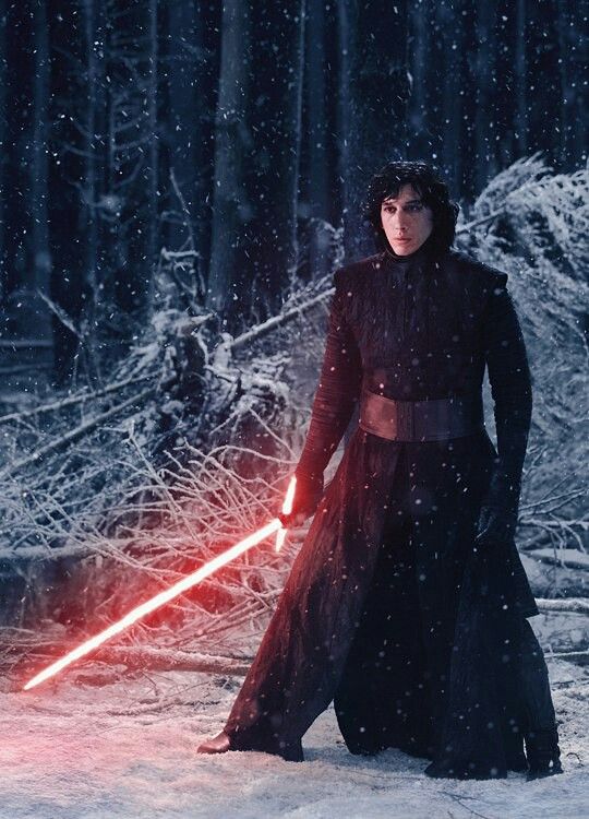 the star wars character kyder standing in the snow with his lightsaber glowing