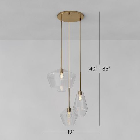 three clear glass pendants hanging from a ceiling fixture with measurements for the length and height