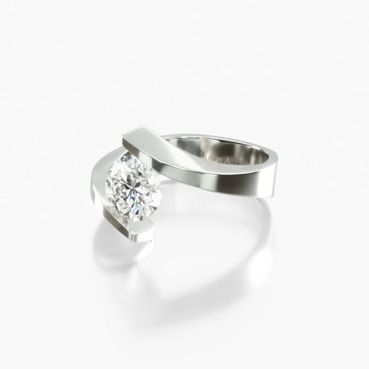 a white gold ring with a single diamond in the center and an open band around it