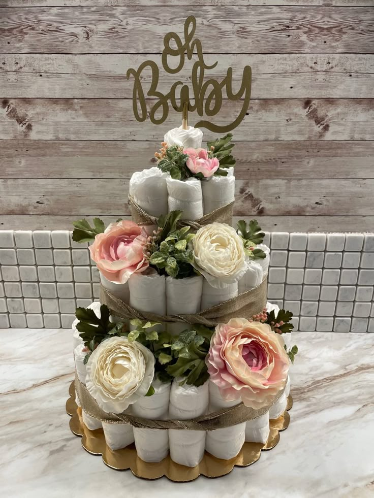 a three tiered cake with flowers on top