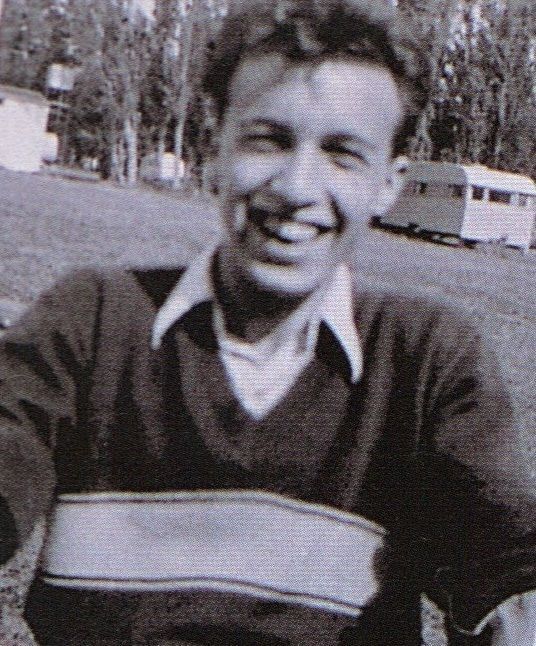 an old black and white photo of a man smiling