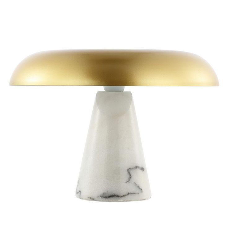 a white and gold colored table lamp on a white background with a light bulb in the shape of a mushroom