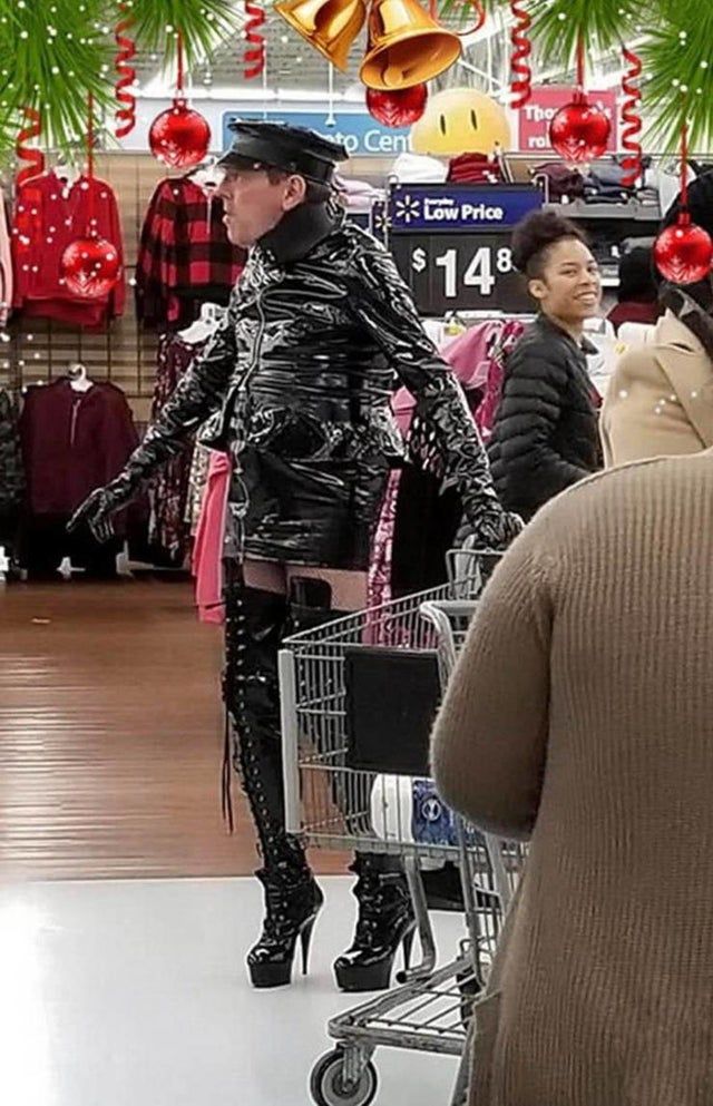 a woman is standing in the middle of a shopping cart