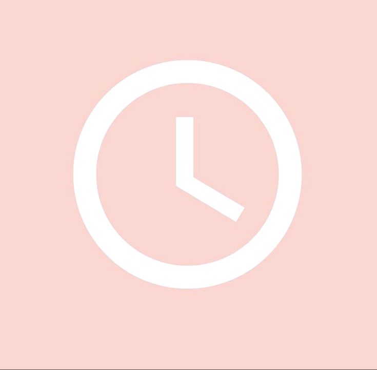 a white clock on a pink background