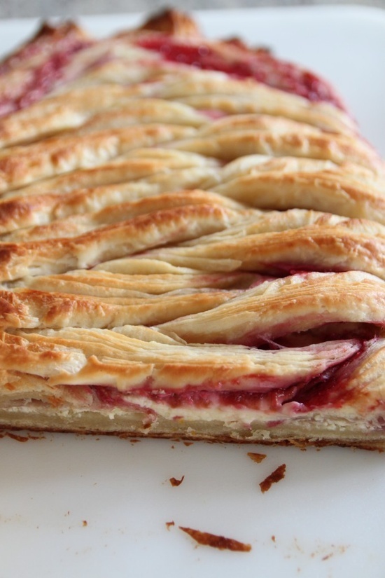 a close up of a pie on a white plate with cranberry toppings