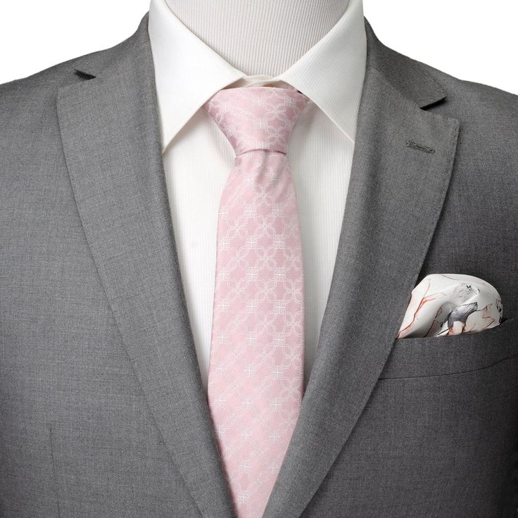 A stunning white floral art deco pattern creates the design for this pink men's tie. The unique and mesmerizing design covers the tie from top to tail and can be worn for both casual and formal events or bring a fresh vibe to the office. Our tie will maintain its shape and hold a perfect knot thanks to the durable yet soft 100% Silk. Fitted Pink Suit And Tie Accessories For Formal Occasions, Elegant Pink Ties For Semi-formal Occasions, White Suit And Tie Accessories For Business In Spring, Elegant White Ties For Spring, Elegant White Spring Ties, Pink Business Ties For Spring, Elegant Pink Ties For Black Tie Occasions, Elegant Pink Standard Tie Suit Accessories, Elegant Pink Standard Tie And Accessories