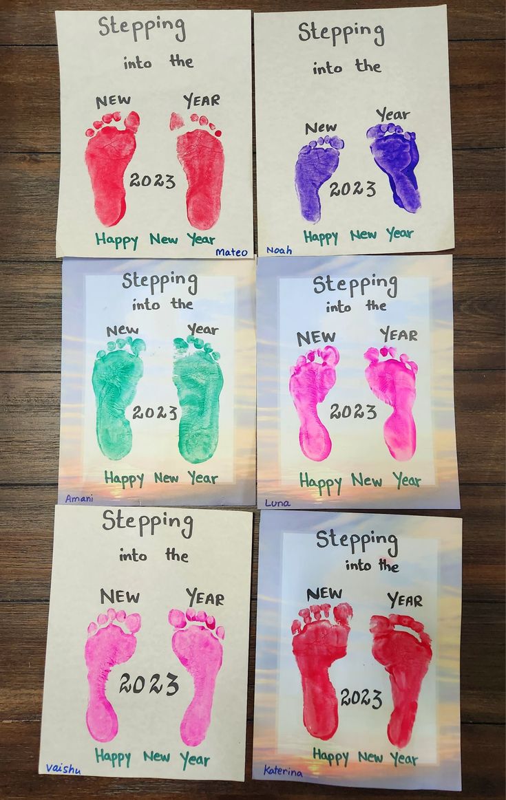 four handprints for new year's eve and baby feet with the words sleeping, happy new year written on them