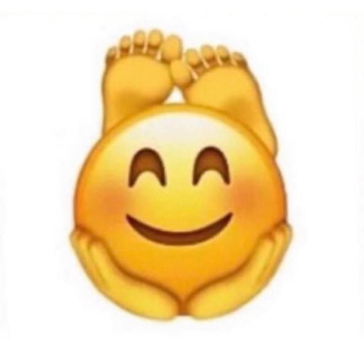 a yellow smiley face with two feet sticking out