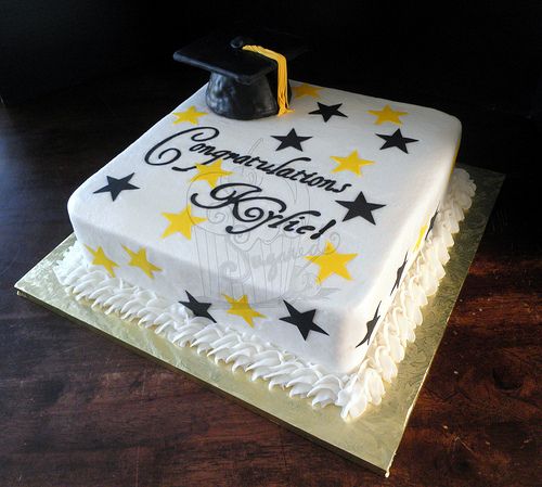 a graduation cake decorated with stars and the words congratulations girl