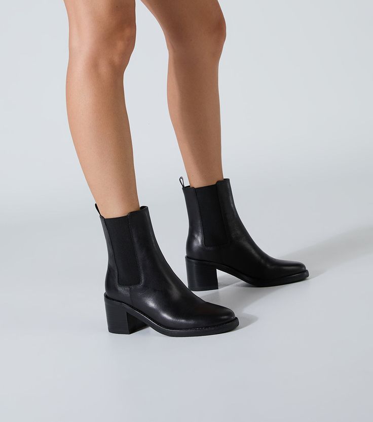 Elevate your style with Albany. Crafted from premium leather, this ankle boot features elastic side panels, a round toe, and a block heel for all-day comfort. Finished in a classic black, these boots are the perfect blend of fashion and function. -Material: Leather -Sole: Rubber -Fit: True To Size -Toe-shape: Round -Features: Block Heel -Heel: 6.5cm Ankle Boots Low Heel, Fitted High Ankle Black Chelsea Boots, Modern Black Chelsea Boots With Block Heel, Sleek Black Chelsea Boots With Reinforced Heel, Elegant Ankle-high Black Chelsea Boots, Black Ankle Boots Outfit, Black Ankle-high Chelsea Boots With Sculpted Heel, Thigh High Boots Flat, Boots Outfit Ankle