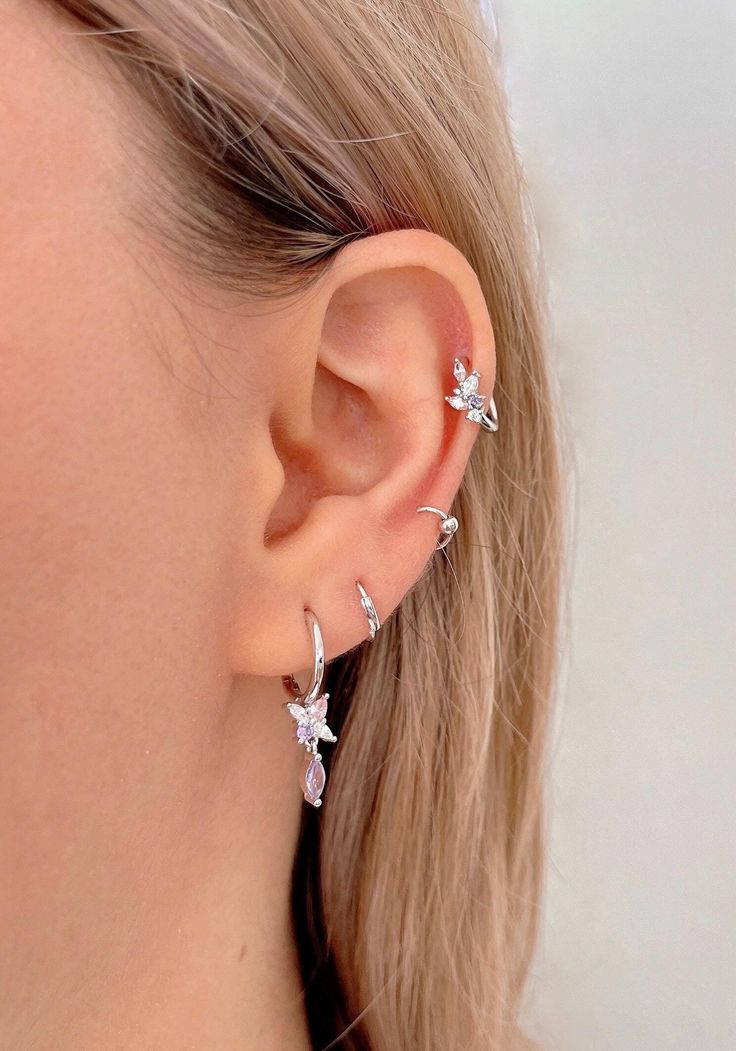 a close up of a person wearing some kind of ear piercing