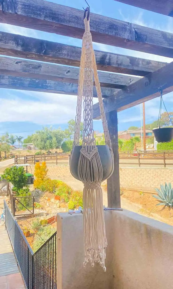 a hammock hanging from the side of a building