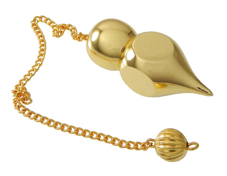 a gold necklace with a bird on it and a ball hanging from the chain,