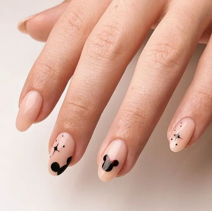 7 Brilliant Disney Nail Designs To Recreate And Wear - Emerlyn Closet Gel Nail Designs Disney, Disney Nails Minimalist, Simple Disney Nail Art, Disney Nails Short Gel, Subtle Mickey Nails, Disney Themed Nails Acrylic Simple, Simple Mickey Nails, Disney Mickey Nails, Cricut Organisation