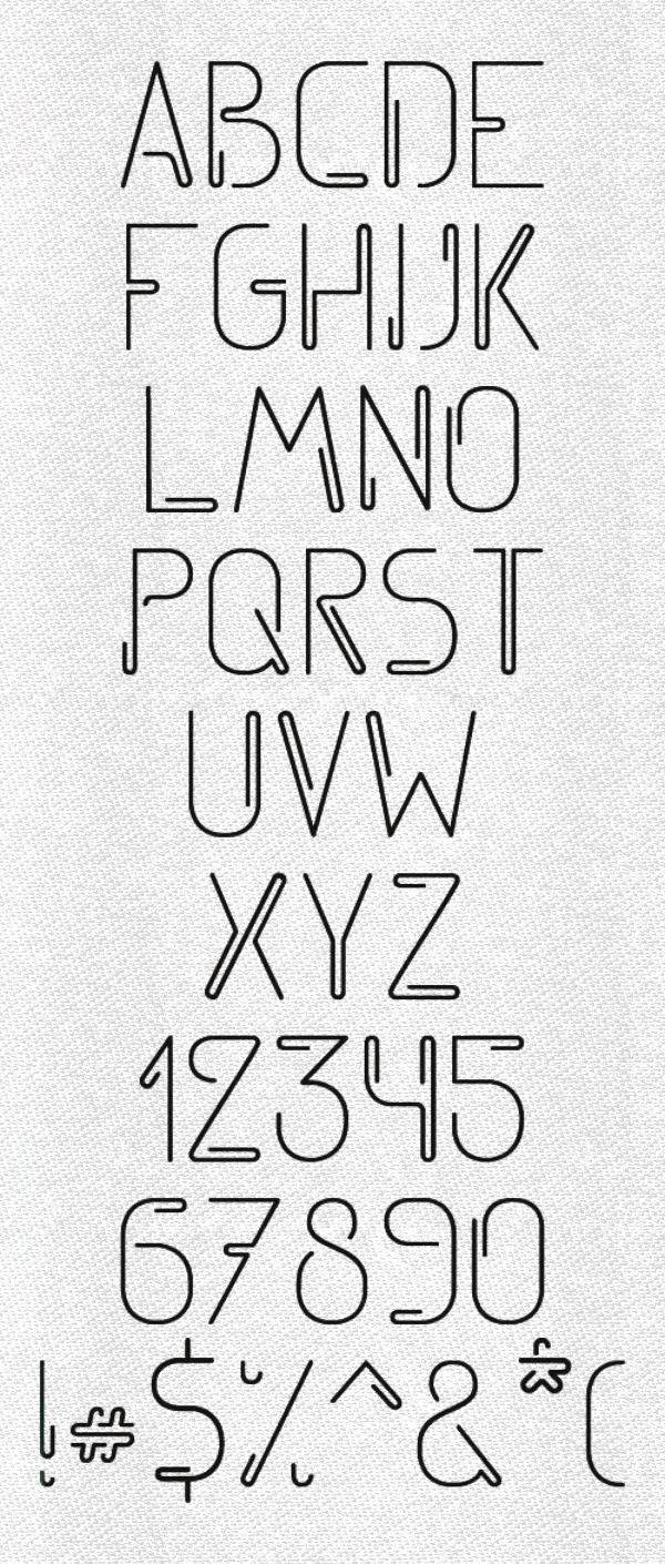 the alphabet and numbers are drawn in black ink on white paper, which has been used to