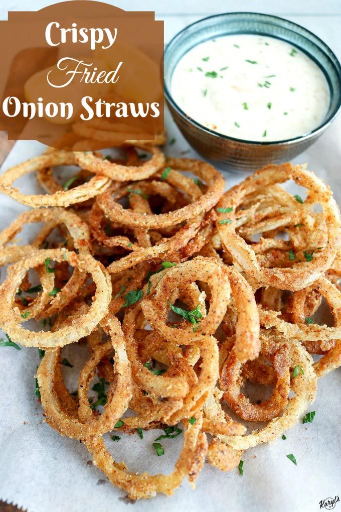 crispy fried onion straws on a napkin with ranch dip in the background and text overlay