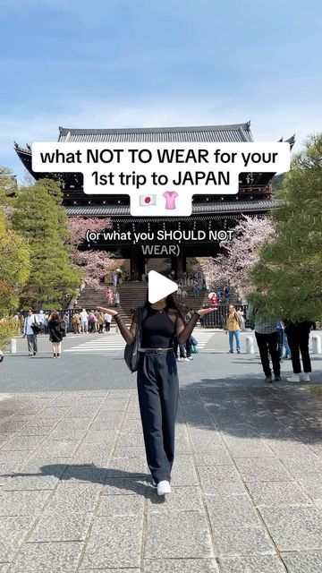 a woman walking down a street with a sign above her head