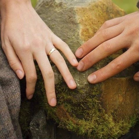 two people with their hands on each other