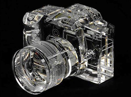 an image of a camera that is made out of clear plastic on a black background