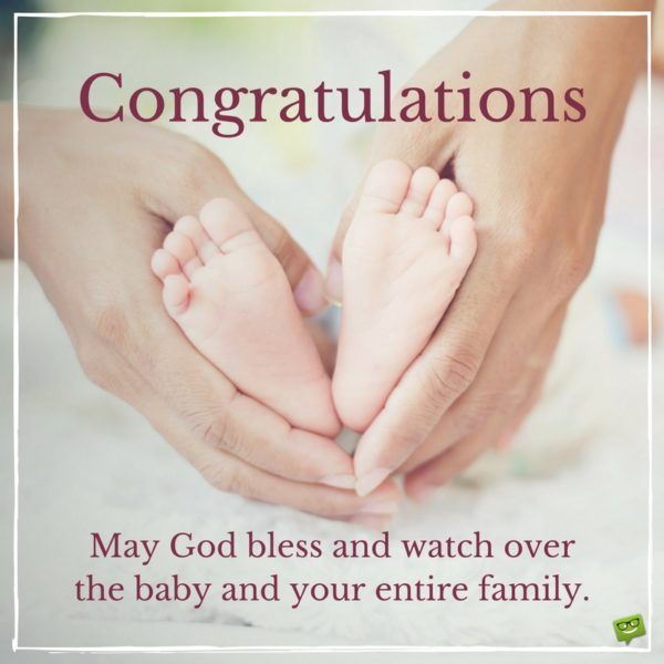 two hands holding the feet of a baby's foot with congratulations written on it