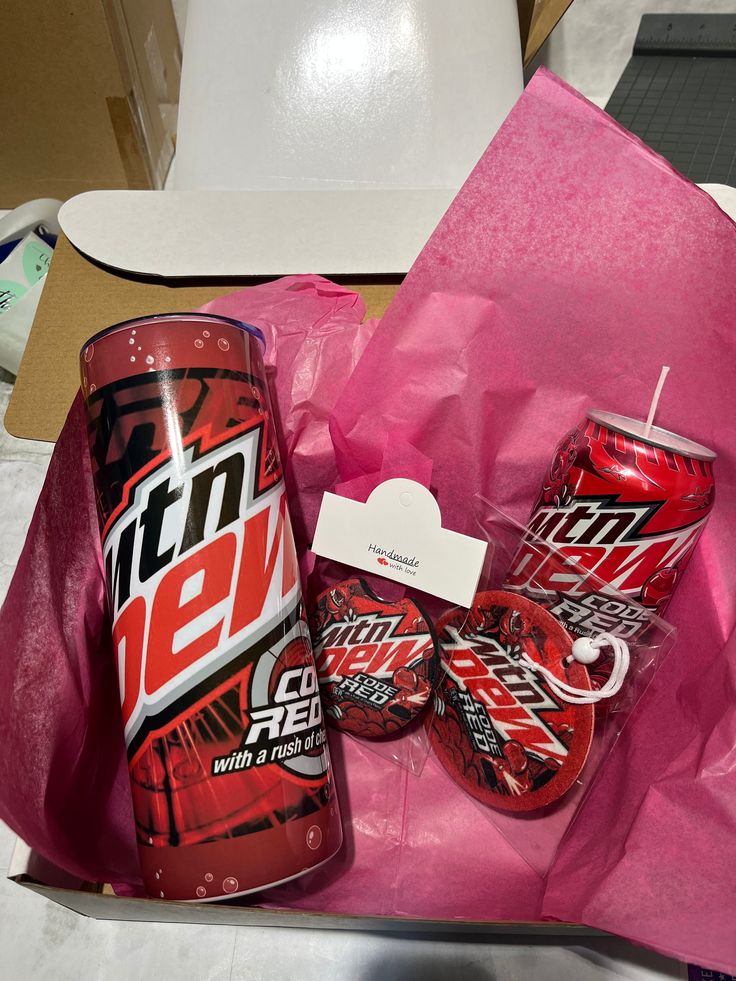 a pink bag filled with cans of mountain dew