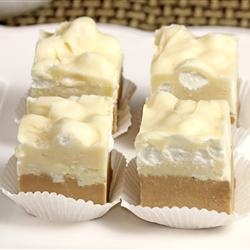 four pieces of cake sitting on top of a white plate