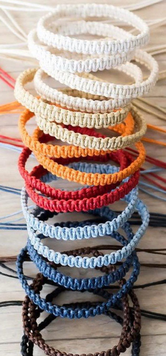 several different colored bracelets sitting on top of each other