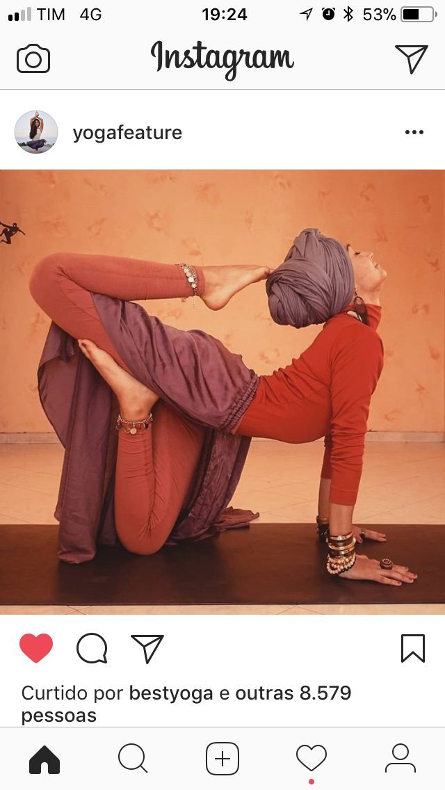 a woman in red pants is doing yoga on the floor with her legs spread out