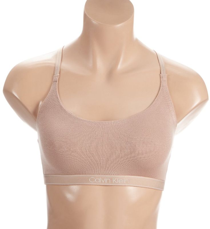 No wires, no adjustments, no hassle. This super soft bralette is just what you need for a comfortable fit that will keep you supported. Wireless bralette has an additional layer of soft knit for more coverage. Super soft modal knit has ribbed texture. Covered elastic along the scoop neckline keeps fit close. Sewn-on elastic underband has Calvin Klein logo at center front. Striped elastic straps have restricted stretch and do not adjust. Straps connect at center back to form a racerback for a spo Ribbed Texture, Keep Fit, Soft Knits, Scoop Neckline, Bralette, Calvin Klein, Comfort Fit, Elastic, Pure Products