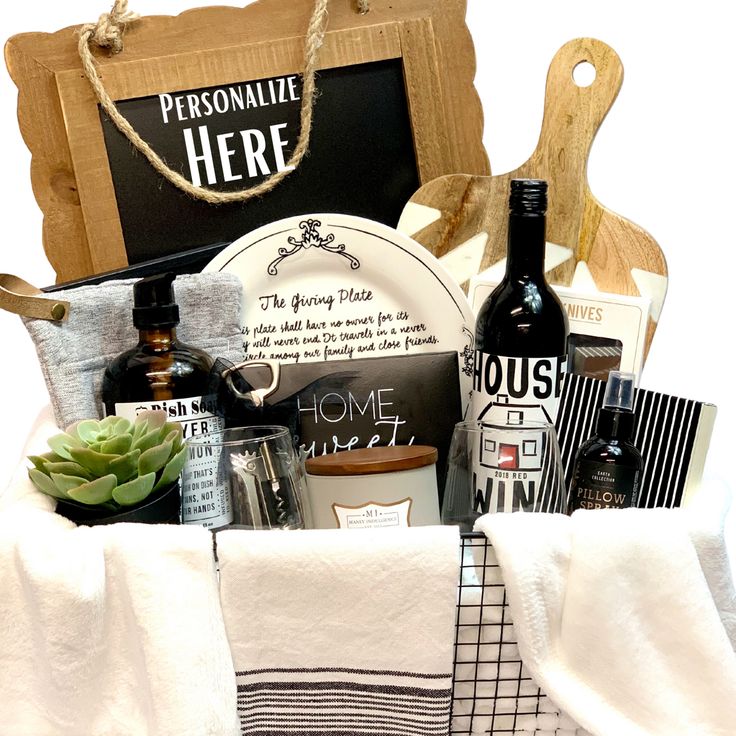 a basket filled with personal care items on top of a white table cloth next to a bottle of wine