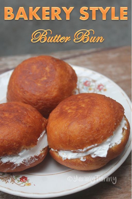 three butter buns on a plate with the words bakery style butter bun written below