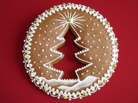 a decorated gingerbread cookie with a christmas tree on it