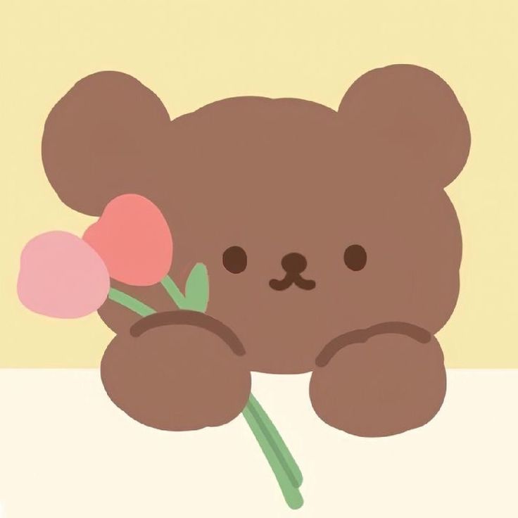 a brown teddy bear holding a pink flower