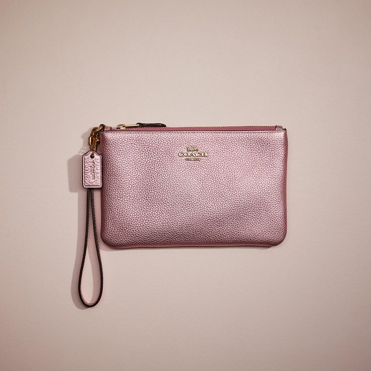 A little (re)love goes a long way. This Small Wristlet is a gently worn design restored to its original condition by the talented craftspeople at our Coach Repair Workshop. Passed along from members of the Coach community like you it helps to keep bags out of landfills and reduces our impact on the environment—part of our commitment to doing better for the planet (and all of us). A feel-good find it’s your chance to get one of our most-loved styles if you missed out the first time. Wear it love Coach Wallets, Doing Better, Small Wristlet, Coach Clutch, Xmas List, Polished Pebble, Coach Logo, Small Clutch, Coach Wallet