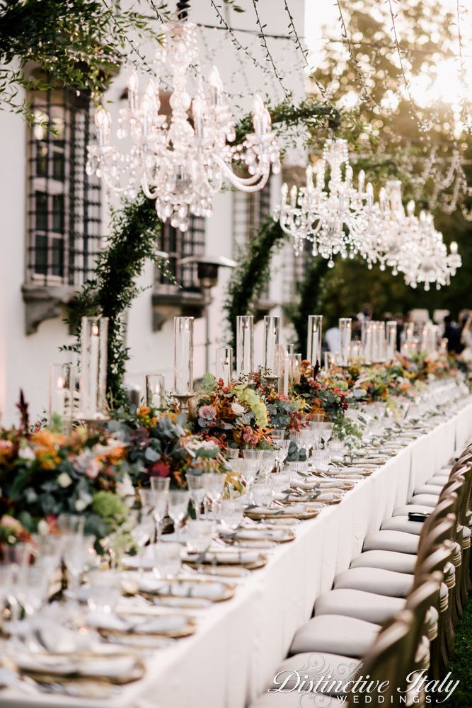 a long table with many plates and glasses on it