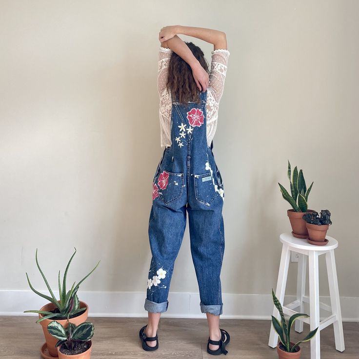 Vintage denim overalls with hand painted red, yellow, and white flowers. Artsy Cotton Jeans For Spring, Spring Paint Splatter Cotton Jeans, Spring Distressed Overalls, Vintage Spring Overalls Jeans, Spring Vintage Overall Jeans, Yellow And White Flowers, Ice Tie Dye, Denim Jumper Dress, Denim Jumper