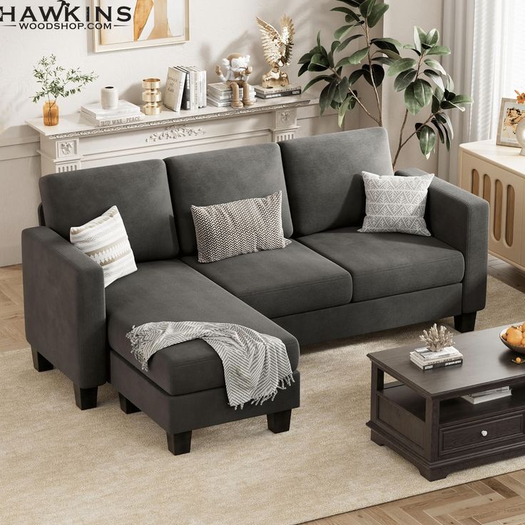 a living room scene with focus on the sectional sofa and footstool in the center