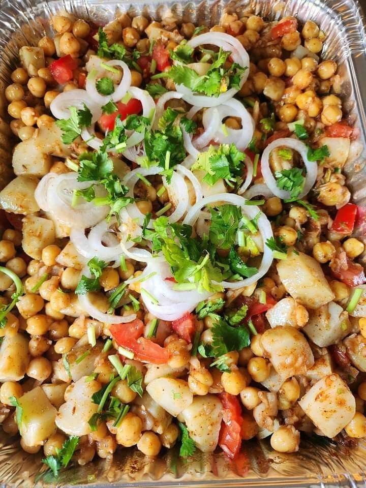 a tray filled with lots of food sitting on top of a table