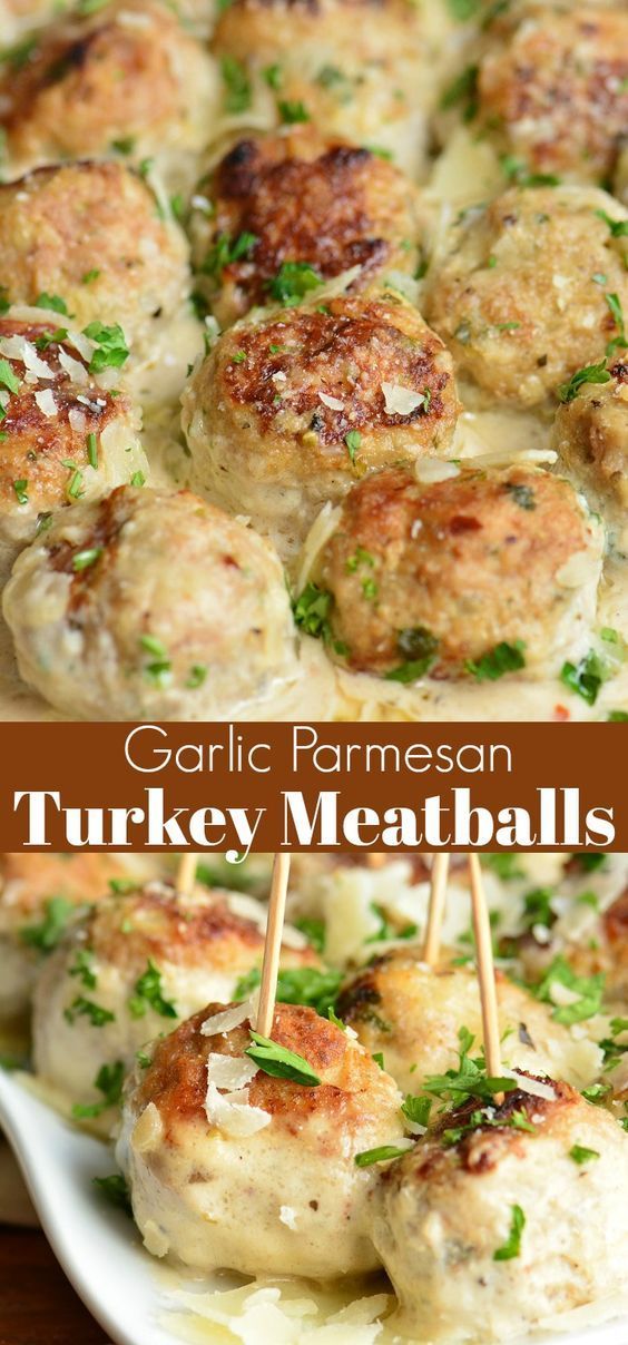 garlic parmesan turkey meatballs on skewers in a white serving dish