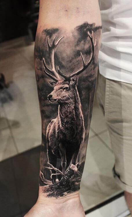 a man with a deer tattoo on his arm