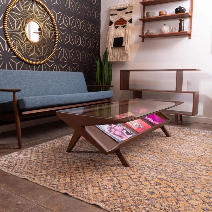 a living room with a couch, coffee table and shelves