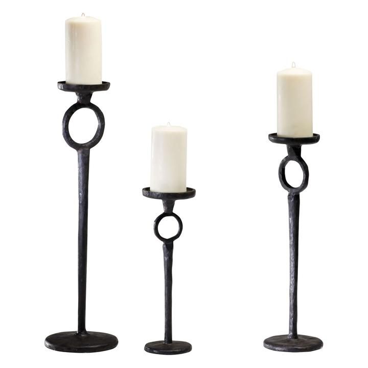 three candles are sitting next to each other