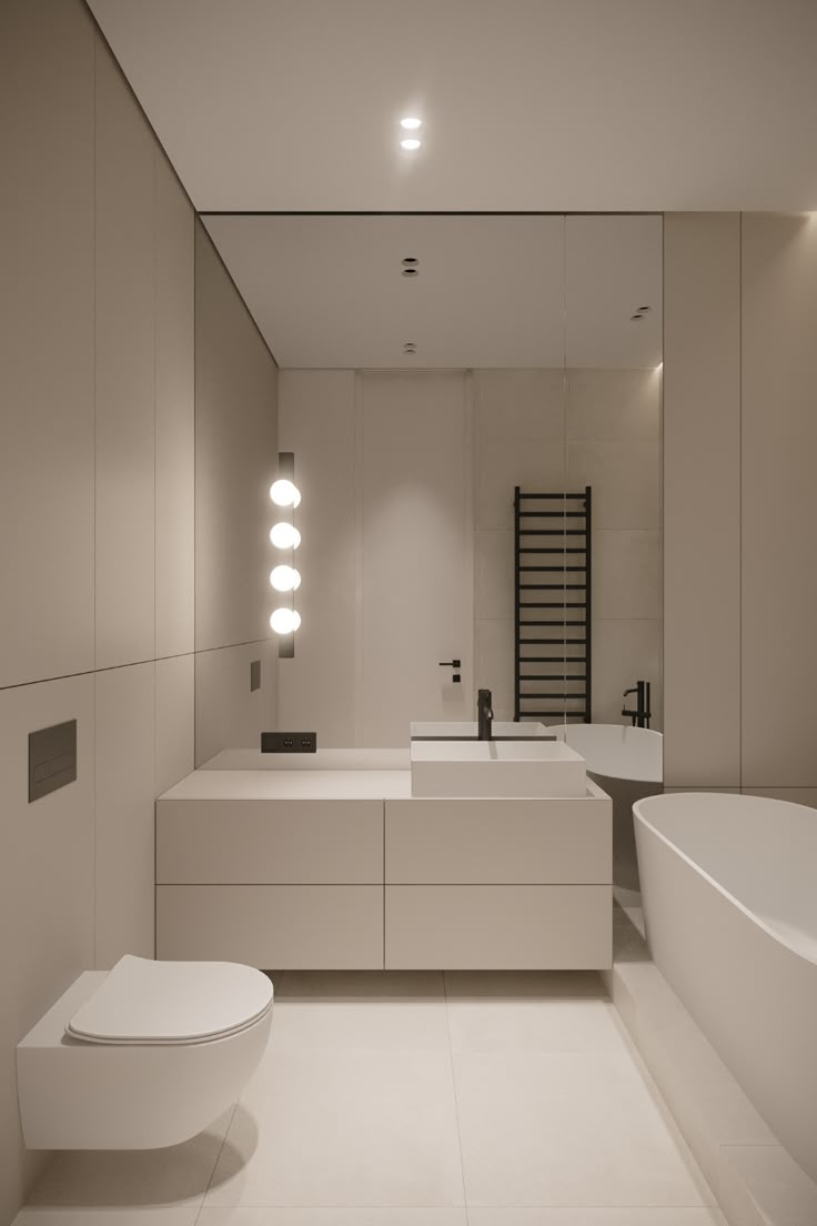 a bathroom with a large white bathtub next to a toilet and sink in it