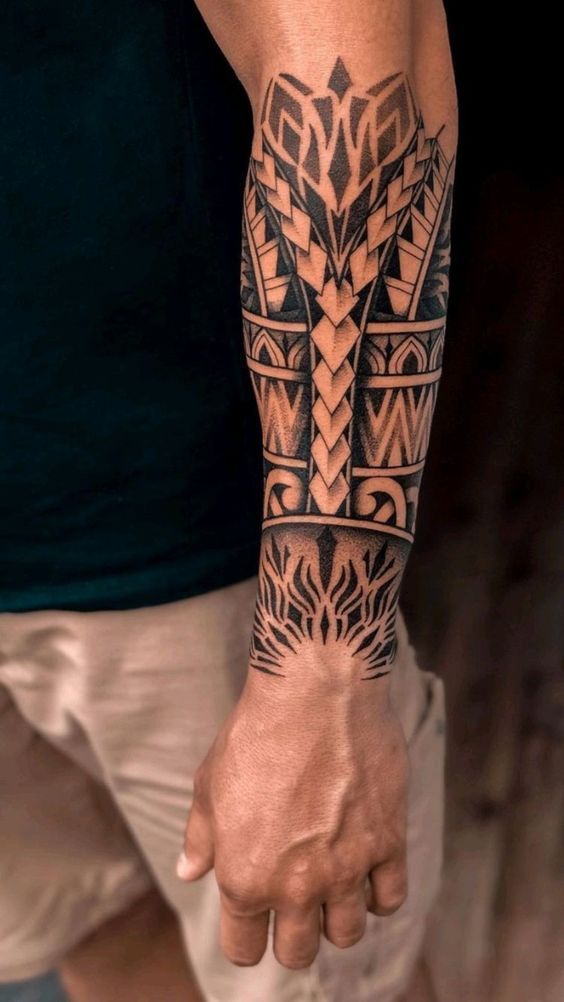 a man with a tattoo on his arm