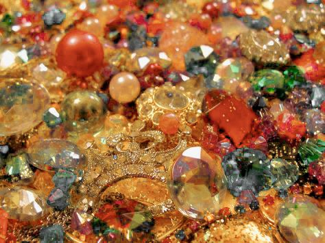 many different colored and shaped buttons on a table